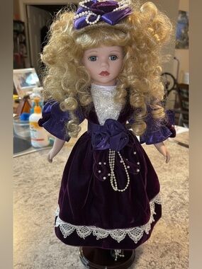 Victorian Beauty Porcelain Blonde Doll 16"-1/2”
Purple Lace Dress